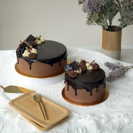 Chocolate cake with hazelnut mousse, topped with buttercream and chocolate ganache drip