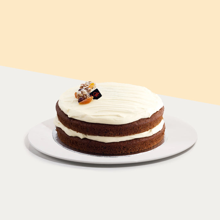 Carrot cake with a lot of spices, grated carrots and cream cheese