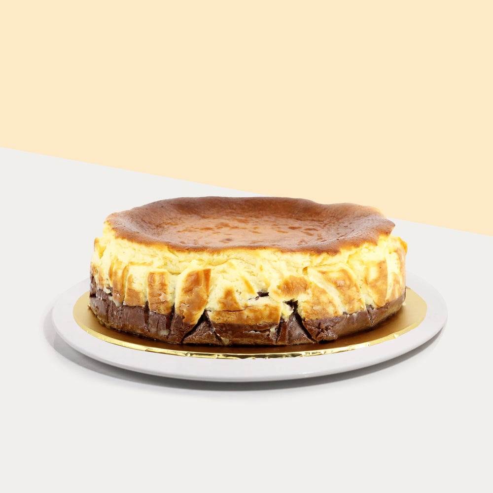 Belgian chocolate infused cheesecake bottom layer along with a classic burnt cheesecake top layer