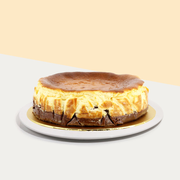 Belgian chocolate infused cheesecake bottom layer along with a classic burnt cheesecake top layer
