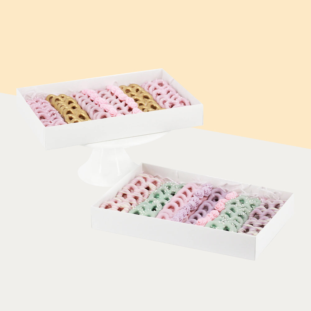 Chocolate covered pretzels covered with gold, pink, purple and green chocolate