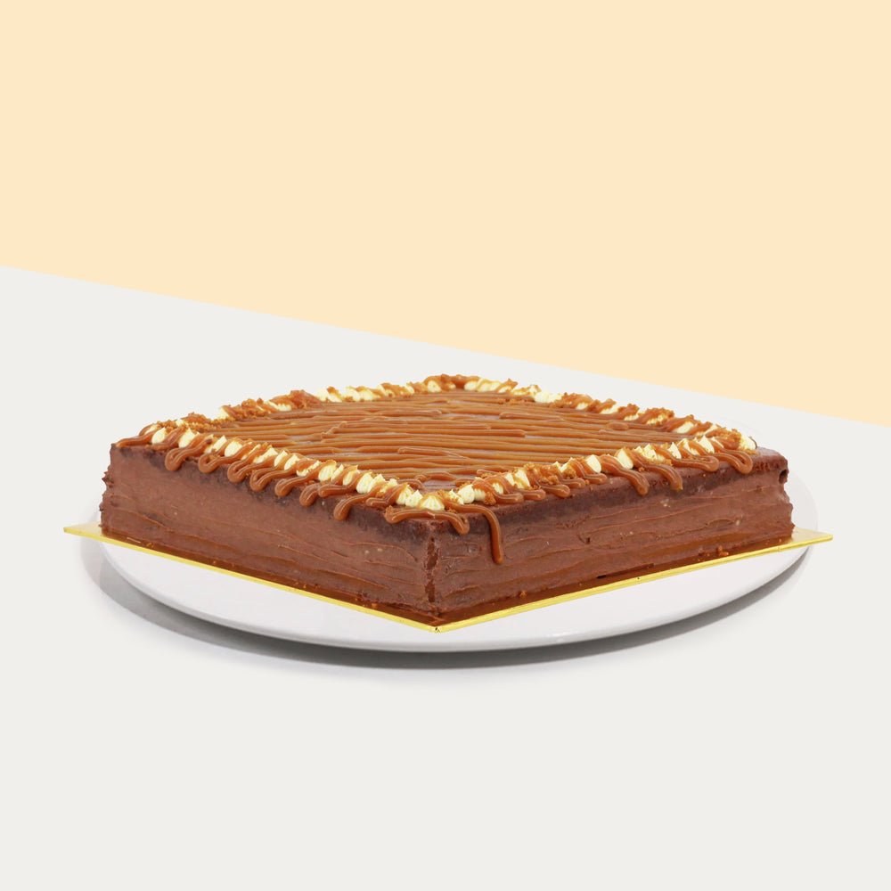 Chocolate cake drizzled with rich caramel sauce