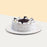 Vanilla sponge cake, coated generously with cookies and fresh cream