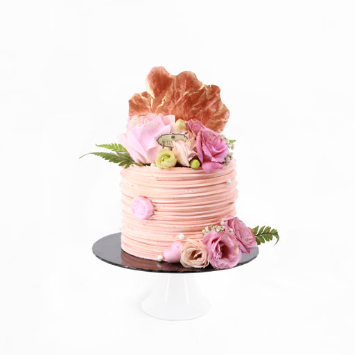 Swirly buttercream cake, decorated with fresh roses
