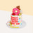 Cake with written pun, topped with a fondant donut and bear figurine