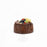 Gluten free dark chocolate burnt cheesecake, topped with fresh fruits
