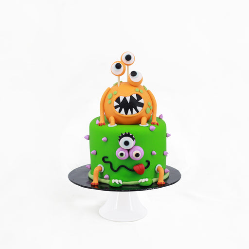 Buttercake hand decorated with monsters design