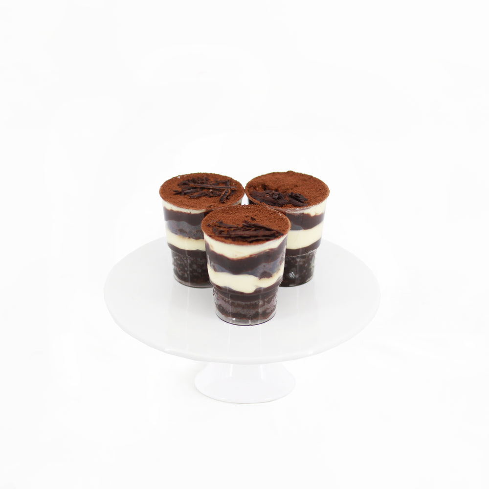 Chocolate sponge cake soaked in coffee with chocolate espresso ganache, with cream cheese and cocoa powder