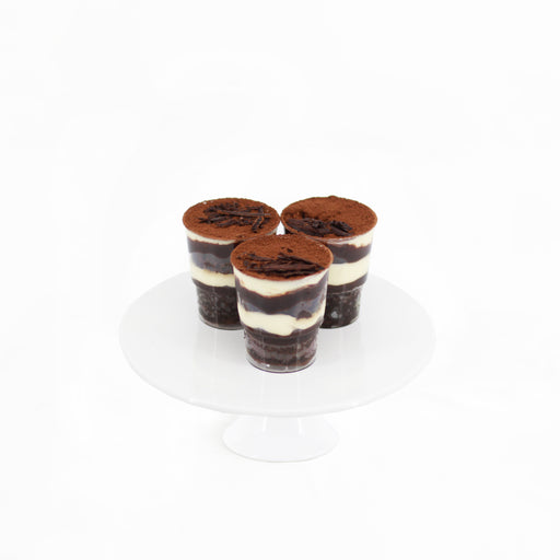 Chocolate sponge cake soaked in coffee with chocolate espresso ganache, with cream cheese and cocoa powder