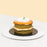 Mini green cake with Gula Melaka layers, topped with Gula Melaka glaze and coconut shavings