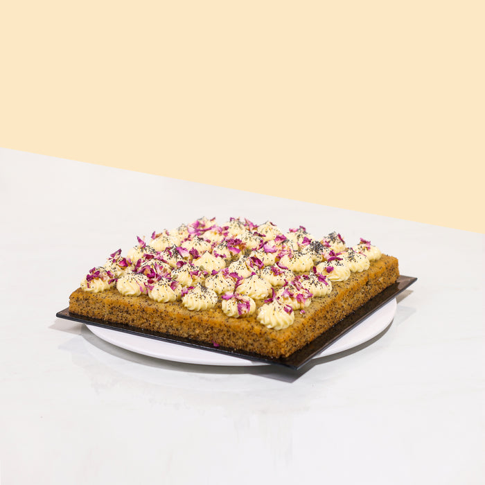 Lemon Poppyseed bites with lemon buttercream, edible flowers and poppyseeds