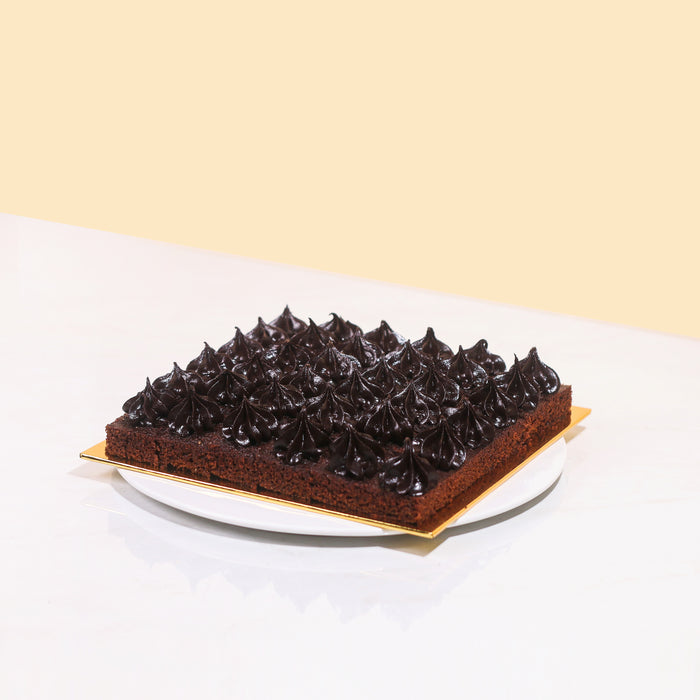 Chocolate bites topped with rich chocolate ganache