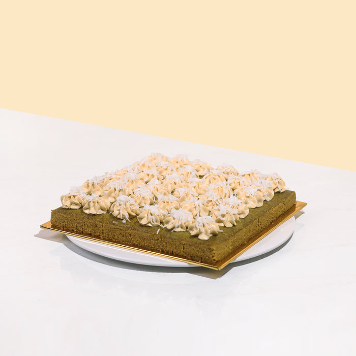Pandan gula melaka bites topped with gula melaka buttercream