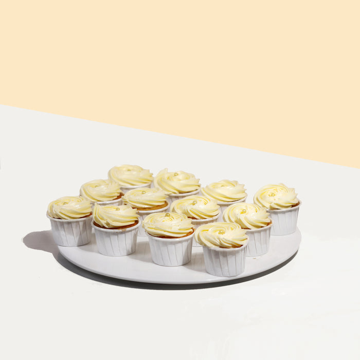 Vanilla cupcakes frosted with vanilla cream cheese