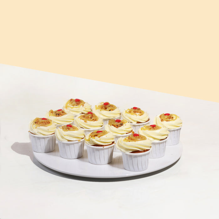 Vanilla cupcakes with vanilla buttercream, glazed with butterscotch sauce