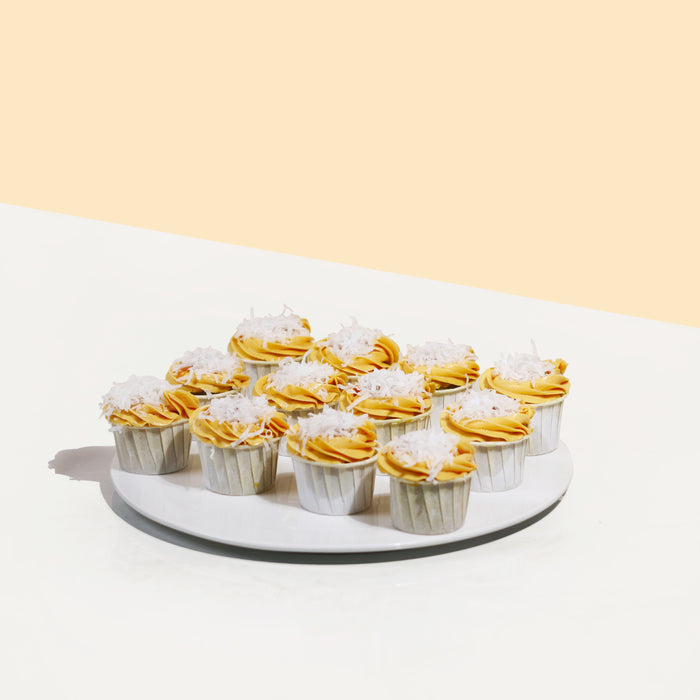 Pandan gula melaka cupcakes with Pandan sponge, topped with gula melaka buttercream and coconut flakes