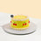 Yellow cake decorated with cream swirls and cream piped cherries