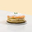 Green cake with Gula Melaka layers, topped with Gula Melaka glaze and coconut shavings