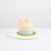 Three toned buttercream cake with vanilla cream cheese and strawberry jam filling