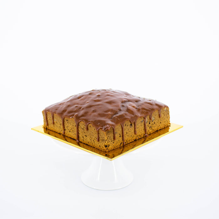 Coffee cake embedded with walnuts, glazed in caramel sauce