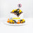 Construction themed cake with toy construction vehicles and fondant safety cones