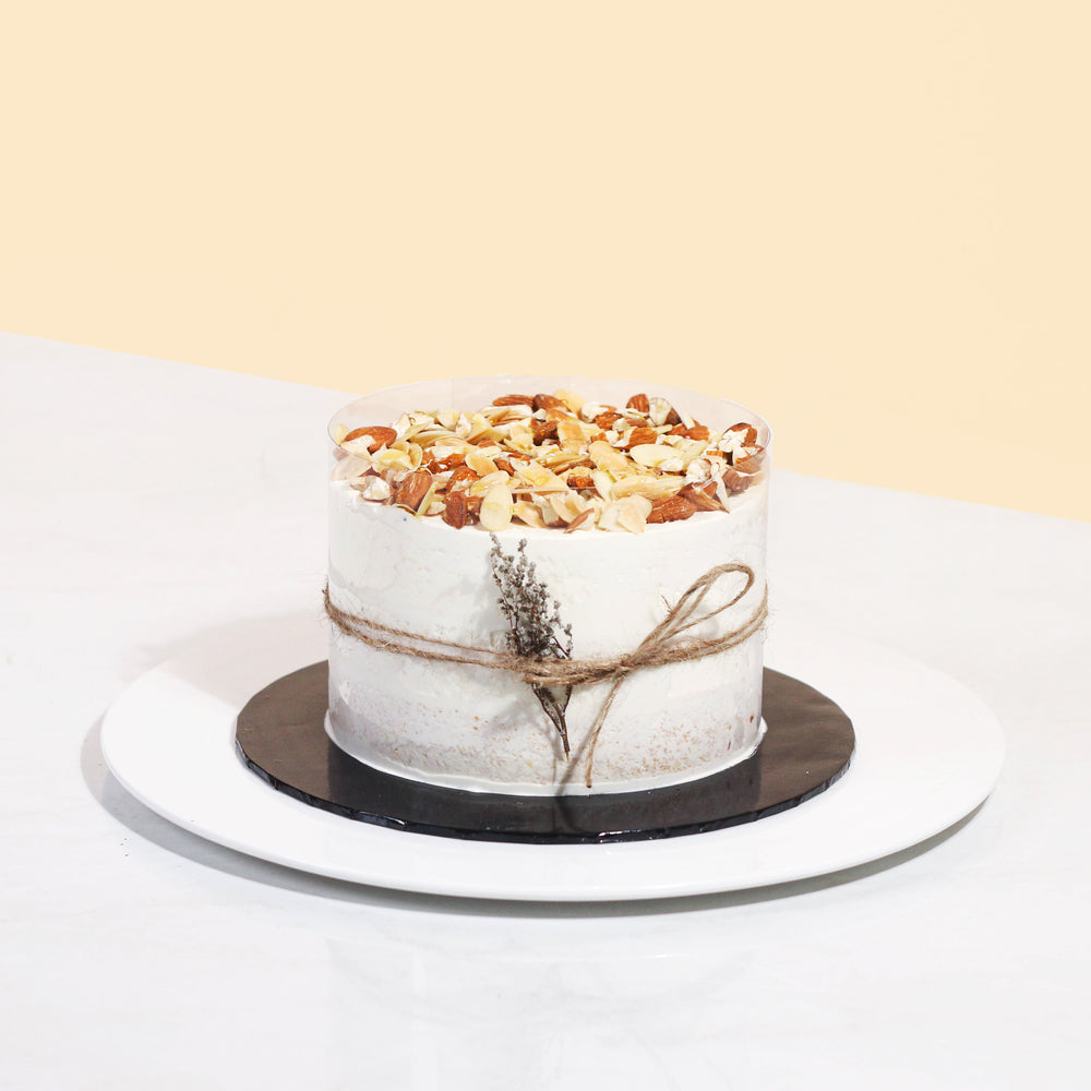 Coffee vegan cake, topped with ground almonds