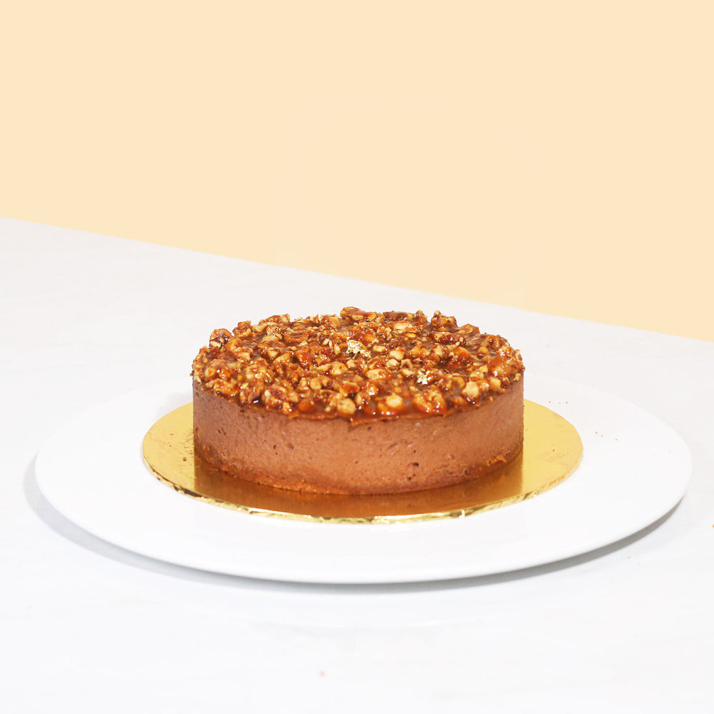 Chocolate truffle cake, topped with crunchy salted caramel hazelnut