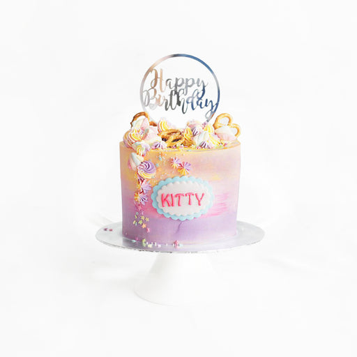 Pink and orange ombre buttercream cake