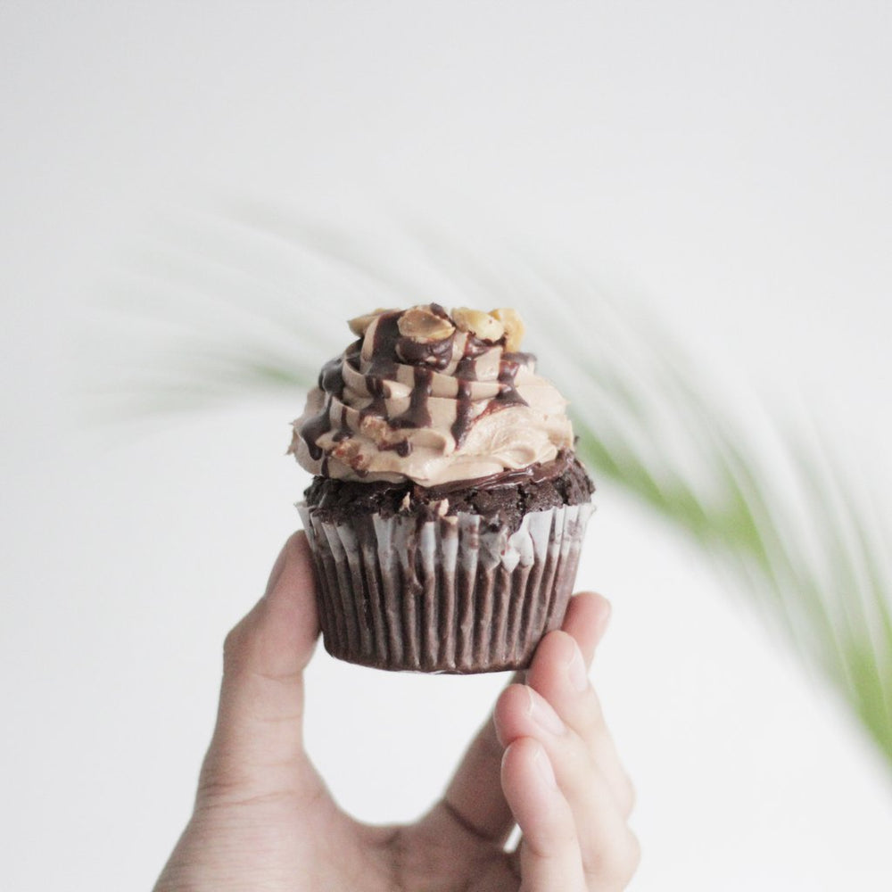 Chocolate hazelnut cupcakes with chocolate cream, and toasted hazelnuts
