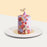 Under the sea themed cake, with blue and red swirls, and chocolate mermaid tail