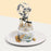 Grey gradient buttercream cake with gold decorations, a crown and confetti balloon