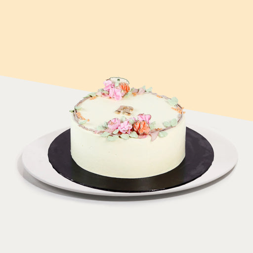 Korean inspired buttercream cake, decorated with hand piped flowers, and an initial of your choice