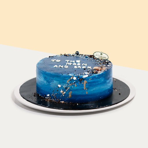 Blue buttercream cake, with edible pearl decorations, and hand piped message on cake
