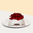 Chocolate chiffon cake, layered with Panna Cotta, blue berry filling, and a red rosette