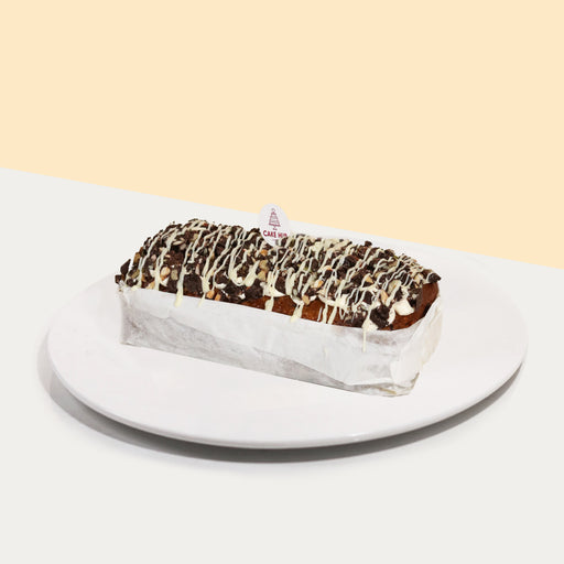 Vegan loaf cake with nuts and dairy-free chocolate