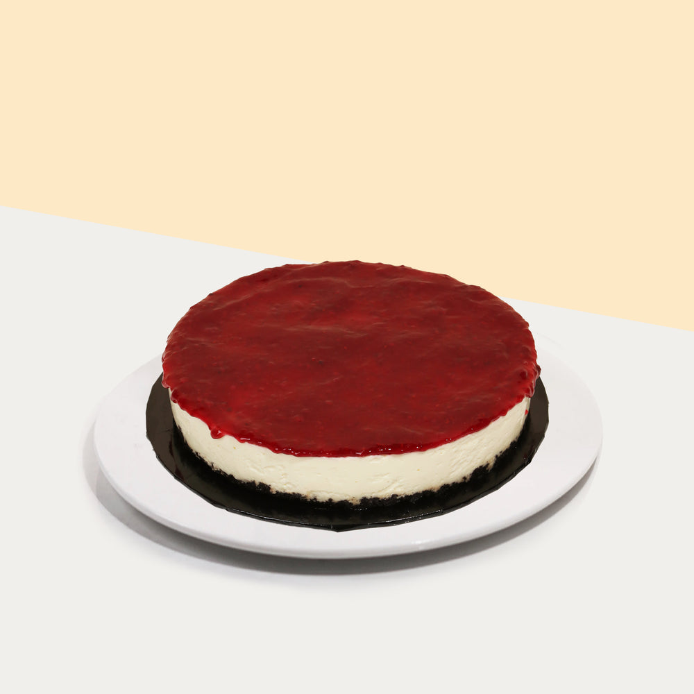 Buttery cookie crumb cheesecake topped with Raspberry filling