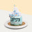 Blue rocking horse themed cake with a 2d printed castle background