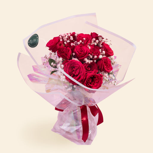 Twelve stalks of roses, wrapped with transparent white border paper