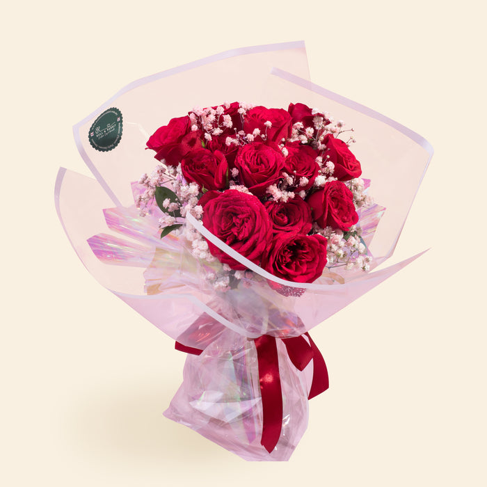 Twelve stalks of roses, wrapped with transparent white border paper