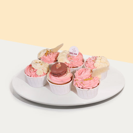 Six pieces of cupcakes, decorated with pink and yellow buttercream