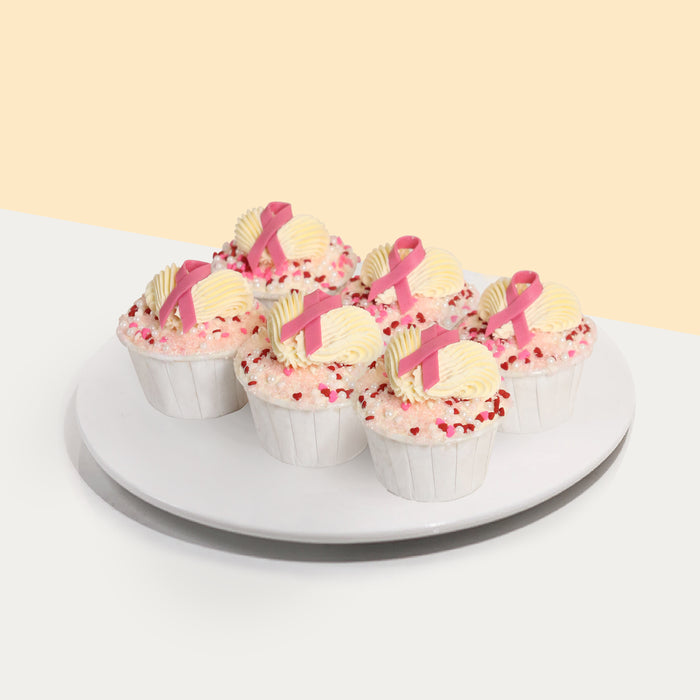 Pink buttercream cupcakes yellow buttercream and breast cancer ribbon