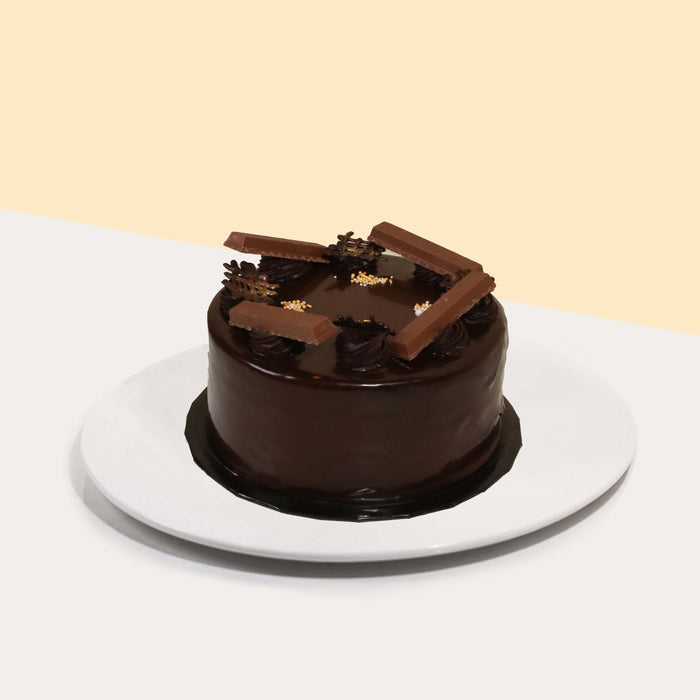 Chocolate sponge cake layered with chocolate ganache, KitKat chocolate, and chocolate chantilly cream