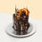 Cake decorated with rock chocolate, pocky and excavator toy