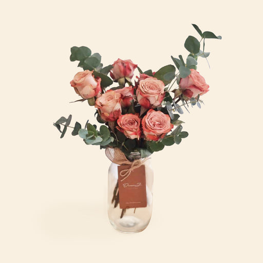 Vintage Kenya Cappuccino roses in a jar with eucalyptus leaves