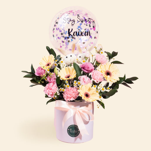 Flower box bouquet with gerberas, carnations, eustoma and chamomiles
