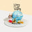 Blue knock knock cake with a fondant king decoration, filled with candies