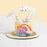 Rainbow coloured buttercream cake, with unicorn decorations
