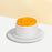 Sponge cake with cream cheese frosting, topped with mango slices