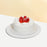 Vanilla sponge cake with signature cream cheese frosting, with fresh strawberries between the layers and on the cake