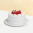 Vanilla sponge cake with signature cream cheese frosting, with fresh strawberries between the layers and on the cake